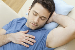 Man Sleeping On Couch